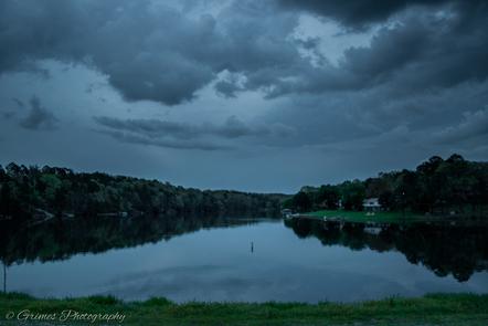 Cloudy Sky over Lake Rayburn with Forest Around