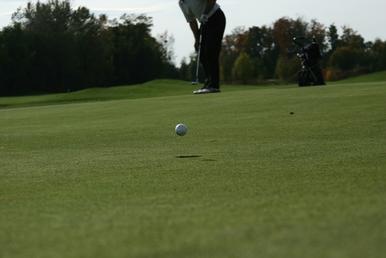 Golfer, Club and Ball in the Air