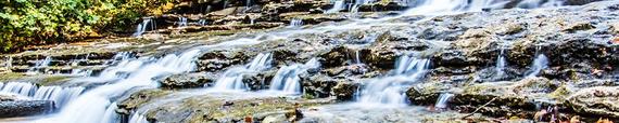 Streams of Water Flowing Over Rocks