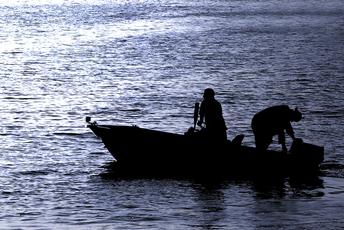 Silhouette of Boaters Headed out Late in the Day