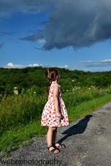 A Young Girl Gazing Clouds near Lake Windsor