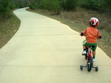 A Kid on a Bike with Helmet